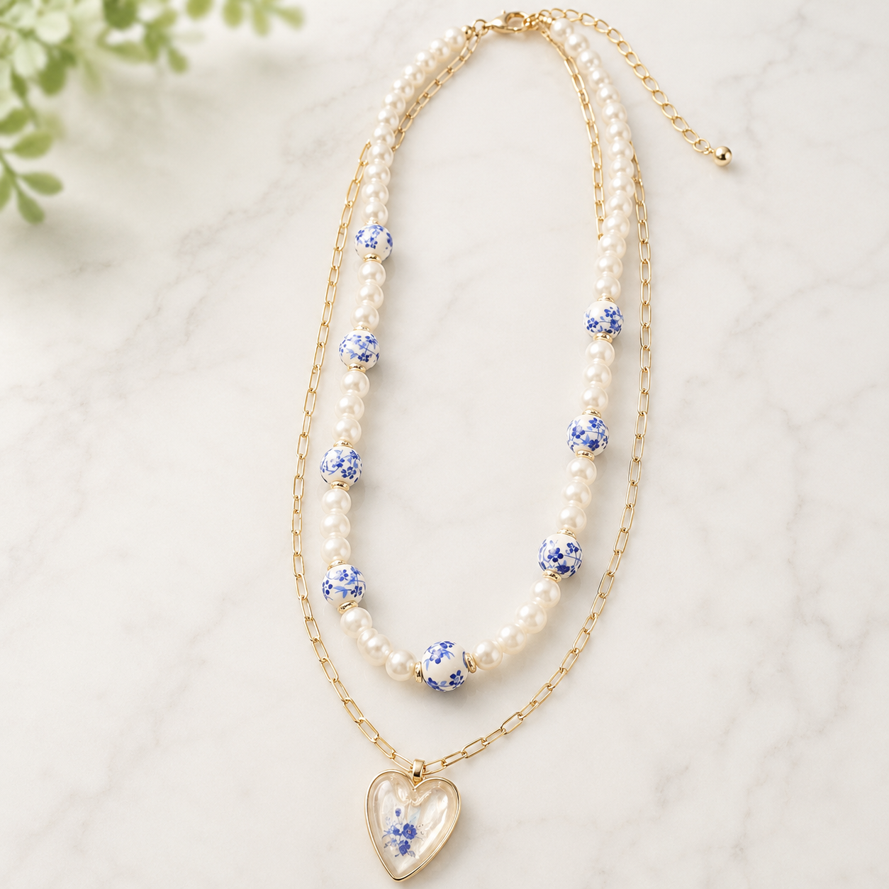 Double Strand Gold & Pearl necklace with blue & white heart pendant