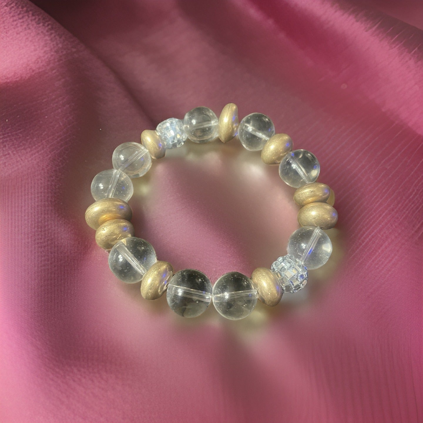 Large Clear beads with gold or silver rounded disc beads and bling beads. Available in 2 colors.