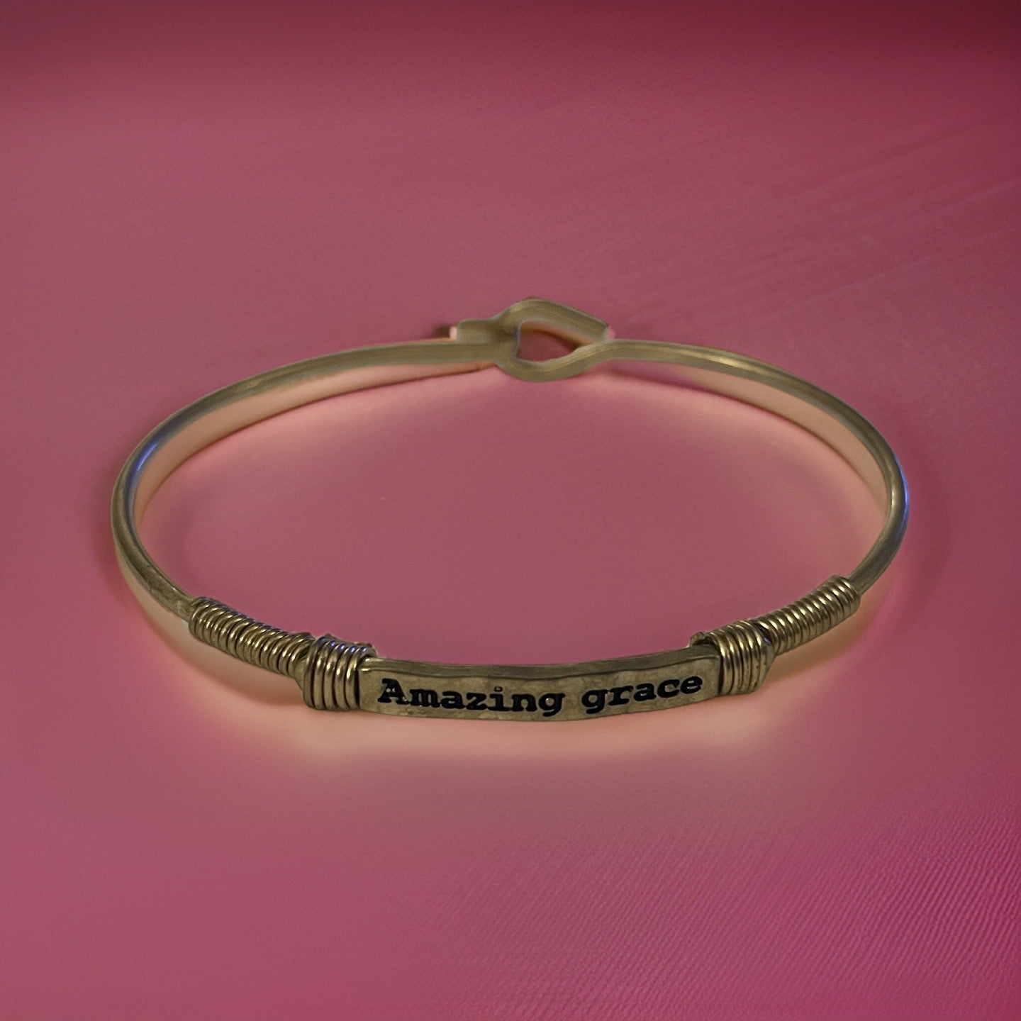 Bracelet with engraved message, "Amazing Grace”. Available in gold and silver