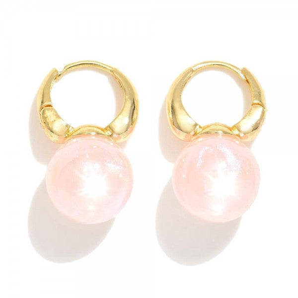 Gold Huggie Hoops Featuring Pink Pearlescent Ball