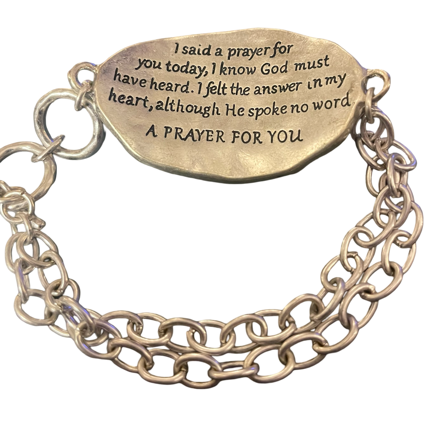 Silver tone toggle bracelet stamped with "A Prayer For You " on a gold tone cross on the front, and a prayer stamped on the back.