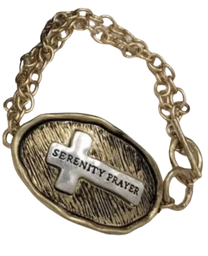 Gold tone toggle bracelet stamped with "Serenity Prayer " on a silver tone cross on the front, and the serenity prayer stamped on the back