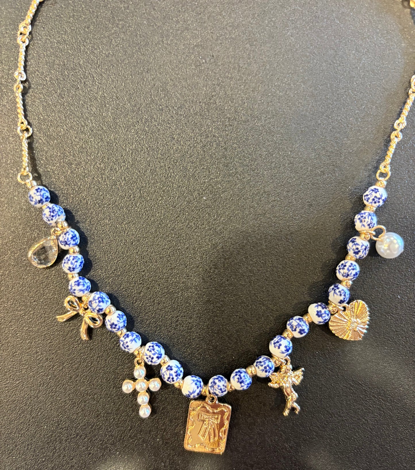 Multi Charm necklace with blue & white ceramic beads