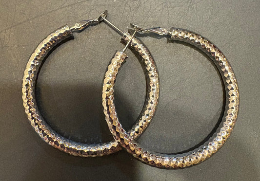 Silver large shiny hammered loop earrings
