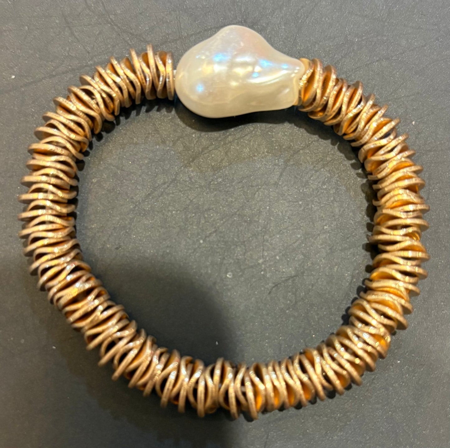 Gold disc and flame pearl bracelet