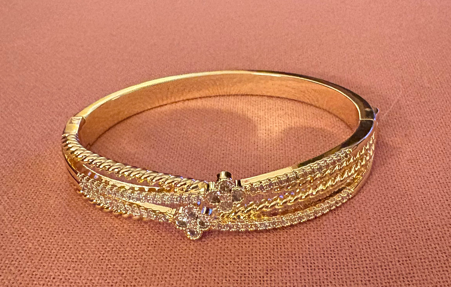 Bracelet - Twisted and layered clover CZ and gold hinged push button lock bangle