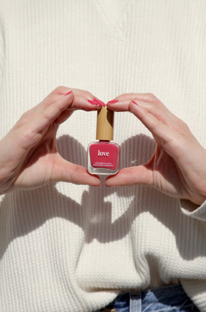 “Love” Non-toxic Nail Polish with an Inspirational reminder® - a soft, sun kissed coral. a cross between red and pink.