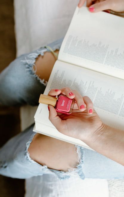 “Love” Non-toxic Nail Polish with an Inspirational reminder® - a soft, sun kissed coral. a cross between red and pink.