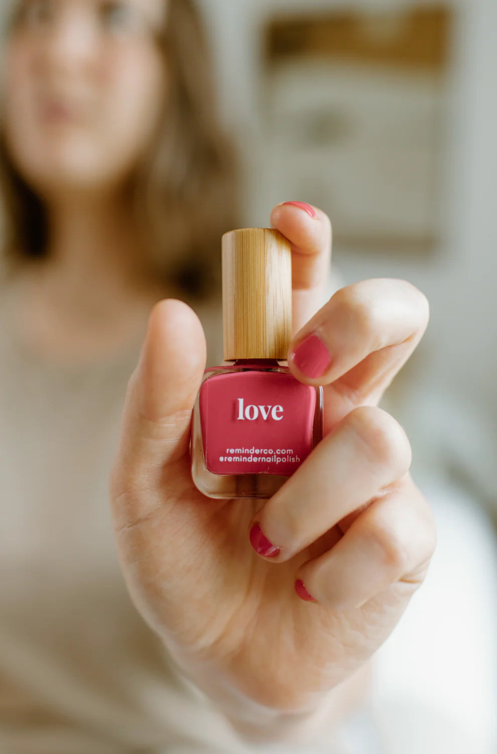 “Love” Non-toxic Nail Polish with an Inspirational reminder® - a soft, sun kissed coral. a cross between red and pink.