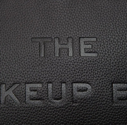 THE MAKEUP BAG - textured faux leather wristlet bag